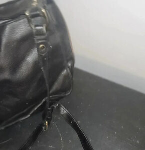 Used black leather purse